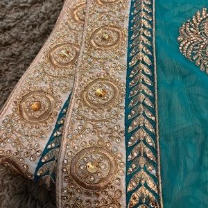 Green and gold saree with thick border. Never worn before.